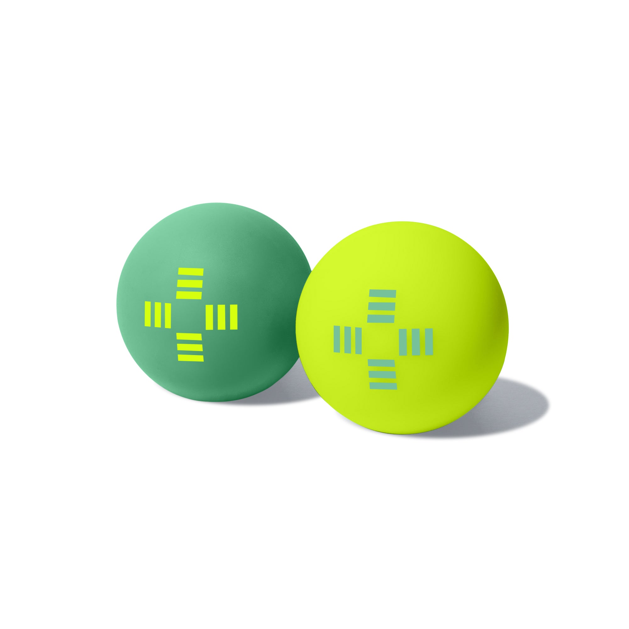 Two foot massage balls - one green with Pedestrian's neon crosswalk logo and one neon with a green crosswalk logo